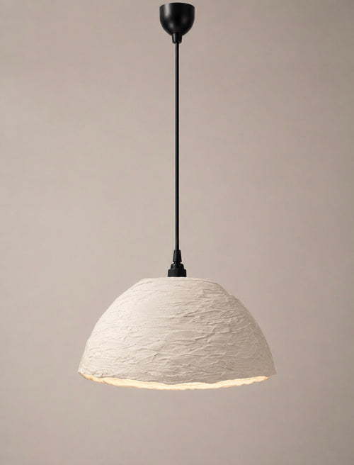 A modern pendant light with a textured, dome-shaped off-white shade and a matte black suspension rod and canopy, shown against a solid warm beige background.