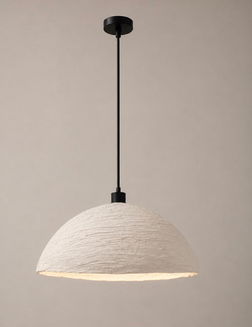 A modern pendant light with a textured off-white dome shade and a matte black suspension rod and canopy, shown against a neutral warm beige background.